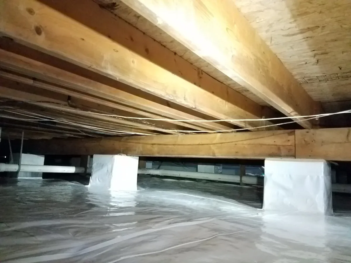 Vapor barrier fitted around foundation piers — Ed Residential LLC, Trappe, MD