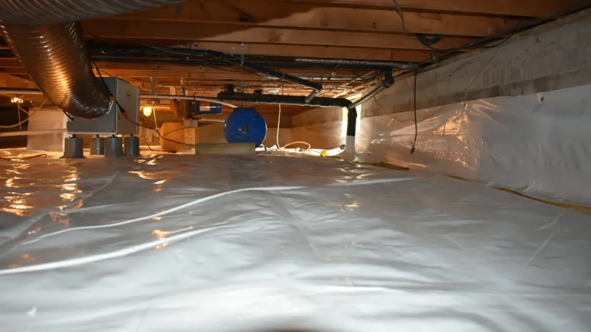 Crawlspace sealed wall to wall with a vapor barrier