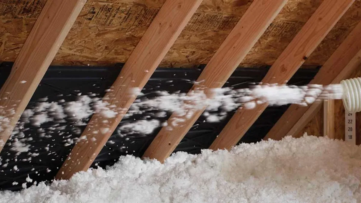 Blowing loose-fill insulation between attic joists